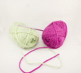 Two coloured hank of filaments on a white background