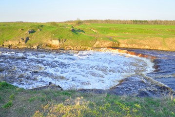 Small waterfall on river.