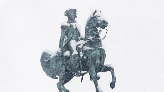 Statue Of Man On Horse In Snowfall