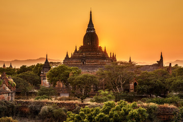 Sunrise above a temple in Bagan