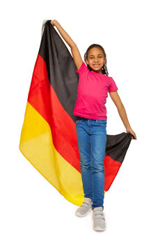 Happy schoolgirl holding big German banner