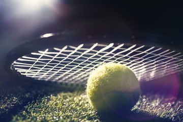 Composite image of close up of tennis ball under a racket