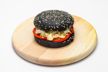 black burger on wooden board