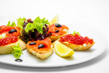 Bruschetta with caviar and salmon