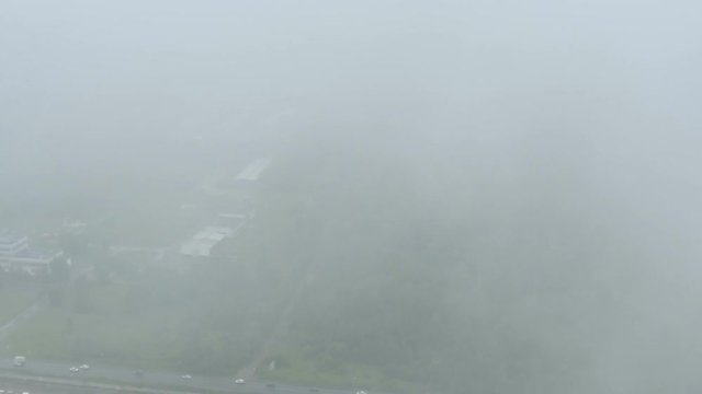 The aircraft flies over the city