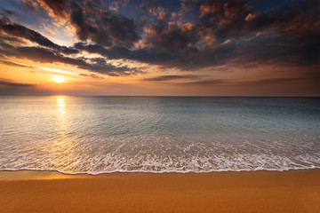 Naklejka na ściany i meble Brilliant ocean beach sunrise.