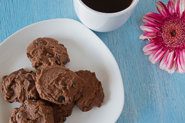 chocolate chip cookies on blue table background