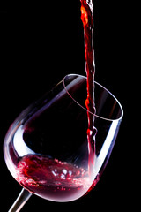 Pouring red wine into the glass