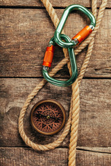 Fototapeta premium ship ropes and compass on wooden background