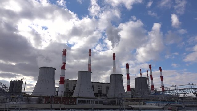 Big heat electrical power plant against winter cloudy sky. 4K footage