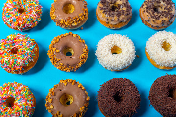 Assorted donuts on a blue background
