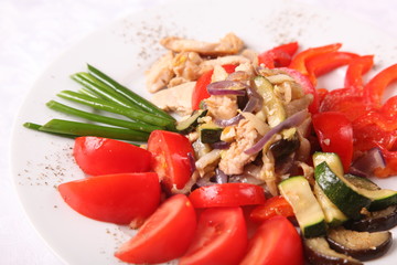 meat with garnish of tomatoes