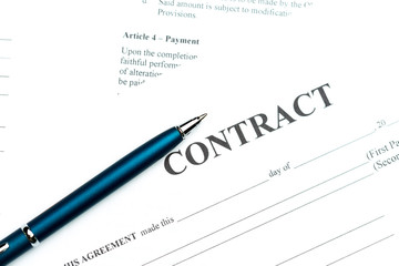Close-up of pen on contract