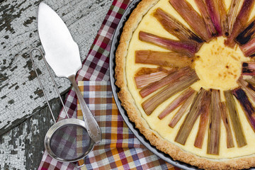 rhubarb pie on rustic background