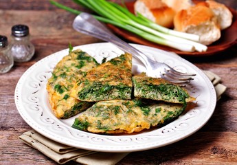 Scrambled eggs with parsley, dill, coriander and green onions. Breakfast.