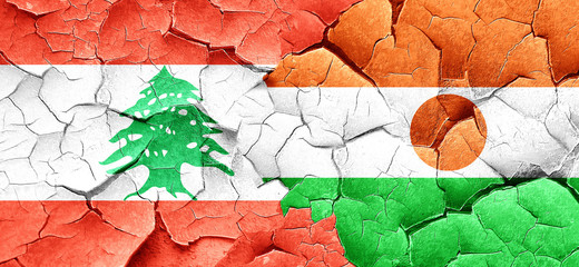Lebanon flag with Niger flag on a grunge cracked wall