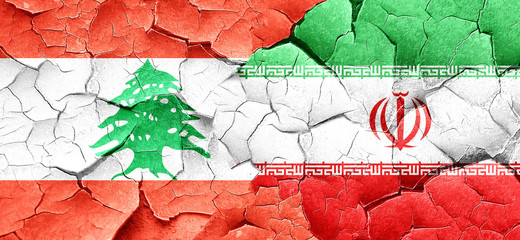 Lebanon flag with Iran flag on a grunge cracked wall