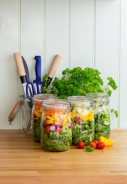 Salad in glass storage jars. Copy space.