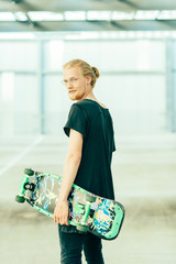 Portrait of Young Long Haired Man with Longboard