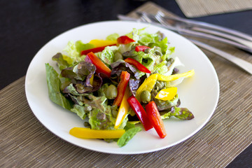 Lunch at the hotel. A fresh vegetable salad. Business lunch. The hotel is five stars. Main dishes. Salad on the table

