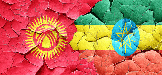 Kyrgyzstan flag with Ethiopia flag on a grunge cracked wall