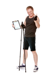 A middle-aged man in a sports t-shirt and shorts is engaged in Nordic walking. Holding a walking...