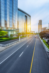 motion blurred traffic with modern buildings background