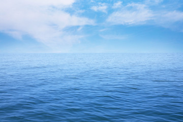 Summer seascape with blue sea and sky background

