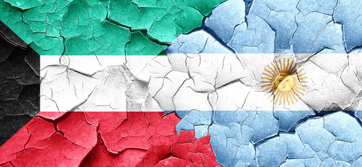 Kuwait flag with Argentine flag on a grunge cracked wall