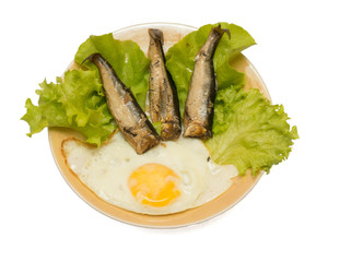 Smoked herring with fried egg and salad isolated