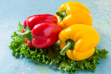 Red and yellow bell peppers and lettuce