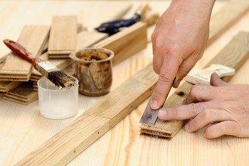 Carpenter hands at work with chisel