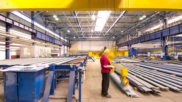 The operator lifting device timelapse hyperlapse, lift loads using lifting magnet, mechanical workshop, metal structures plant.