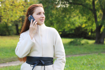Fototapeta premium girl walking in the park in autumn
