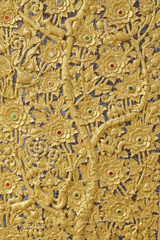 The gold stucco design of native thai style on the Wall