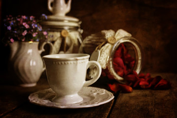 Obraz na płótnie Canvas retro effect on photo vintage tea with rose dry petal