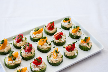 hummus bites with cucumber and tomatoes 