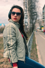 girl in park with headphone