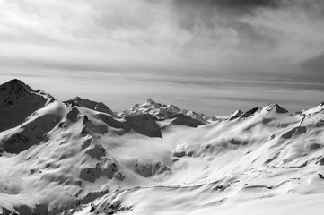 Obraz premium Black and white snowy mountains in evening