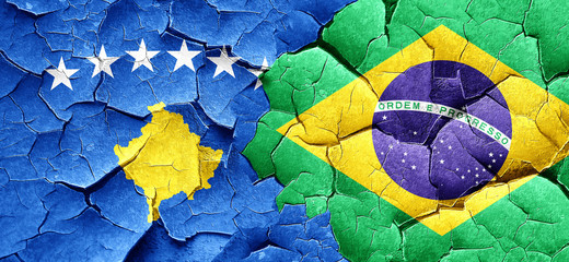 Kosovo flag with Brazil flag on a grunge cracked wall