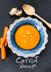 carrot soup with ginger over slate background