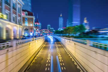 light trails with skysrapers background,tianjin china.