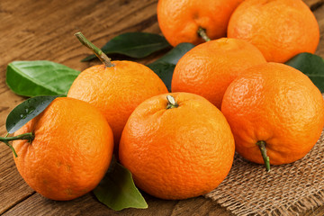 Tangerines on rustic background.