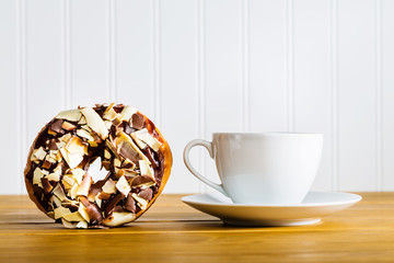 Chocolate donut with coffee mug