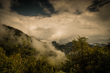 Mountains and clouds in the rainforest. Dramatic clouds with mountain and tree in the morning shot.