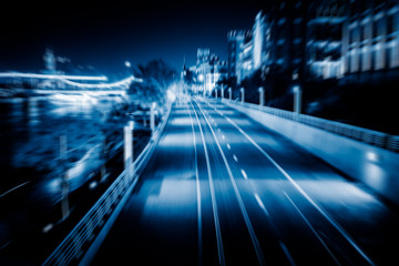 light trails with skysrapers background,tianjin china.