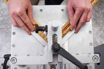 Craftsman working on frame in frameshop.