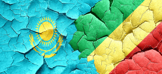 Kazakhstan flag with congo flag on a grunge cracked wall