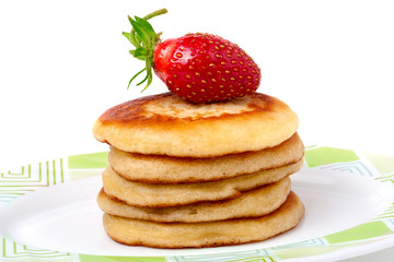 fritters on a plate with strawberries isolated white background