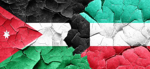 Jordan flag with Kuwait flag on a grunge cracked wall